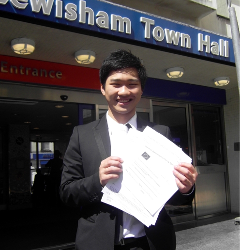 steven_cheung_with_the_official_papers_to_confirm_his_nomination.jpg